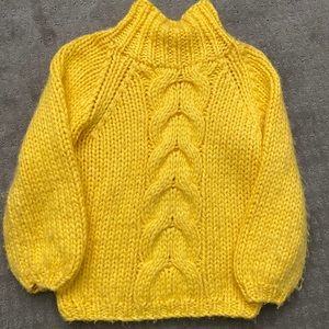 Clad and cloth yellow sweater